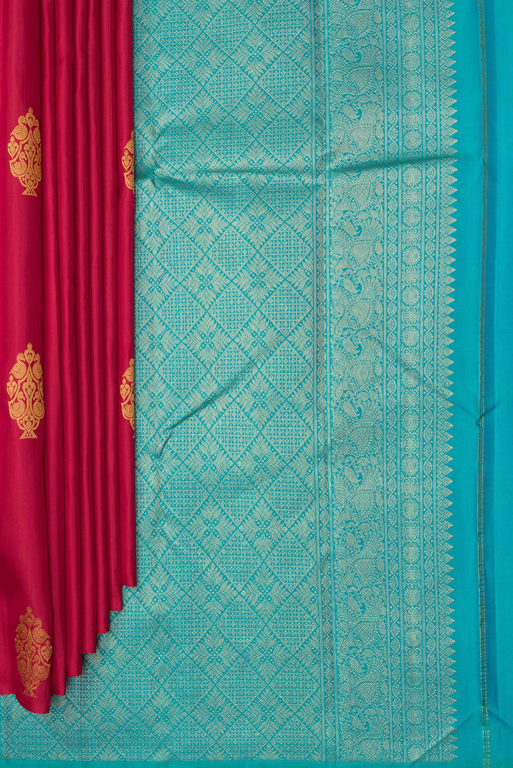 Pleats and pallu of Pure Silk Red Kanchipuram Saree with Zari Butta on the body and Without Border. 