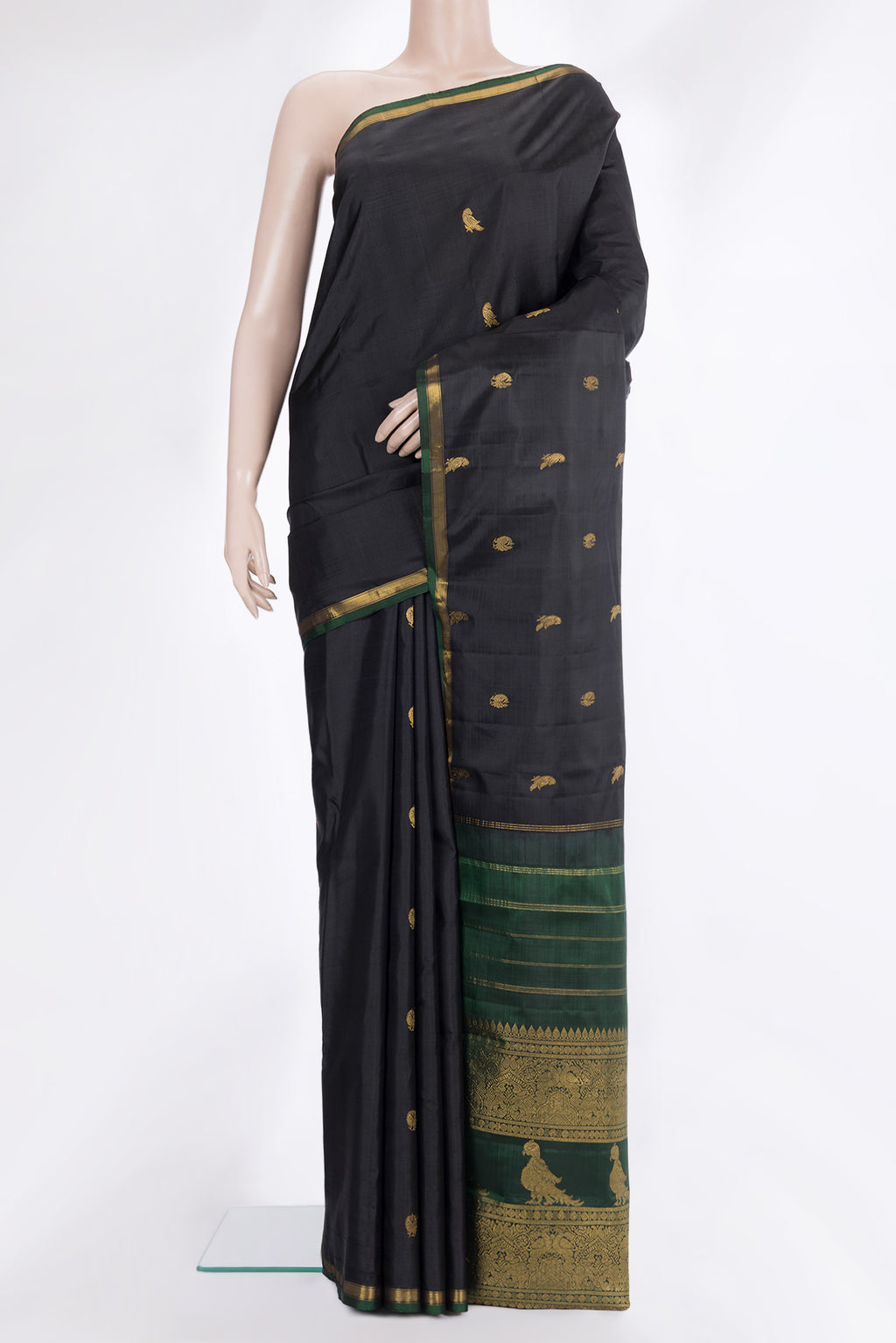 Pure Silk Black Kanchipuram Saree with Zari Butta on the body and Zari Border.  displayed on a mannequin