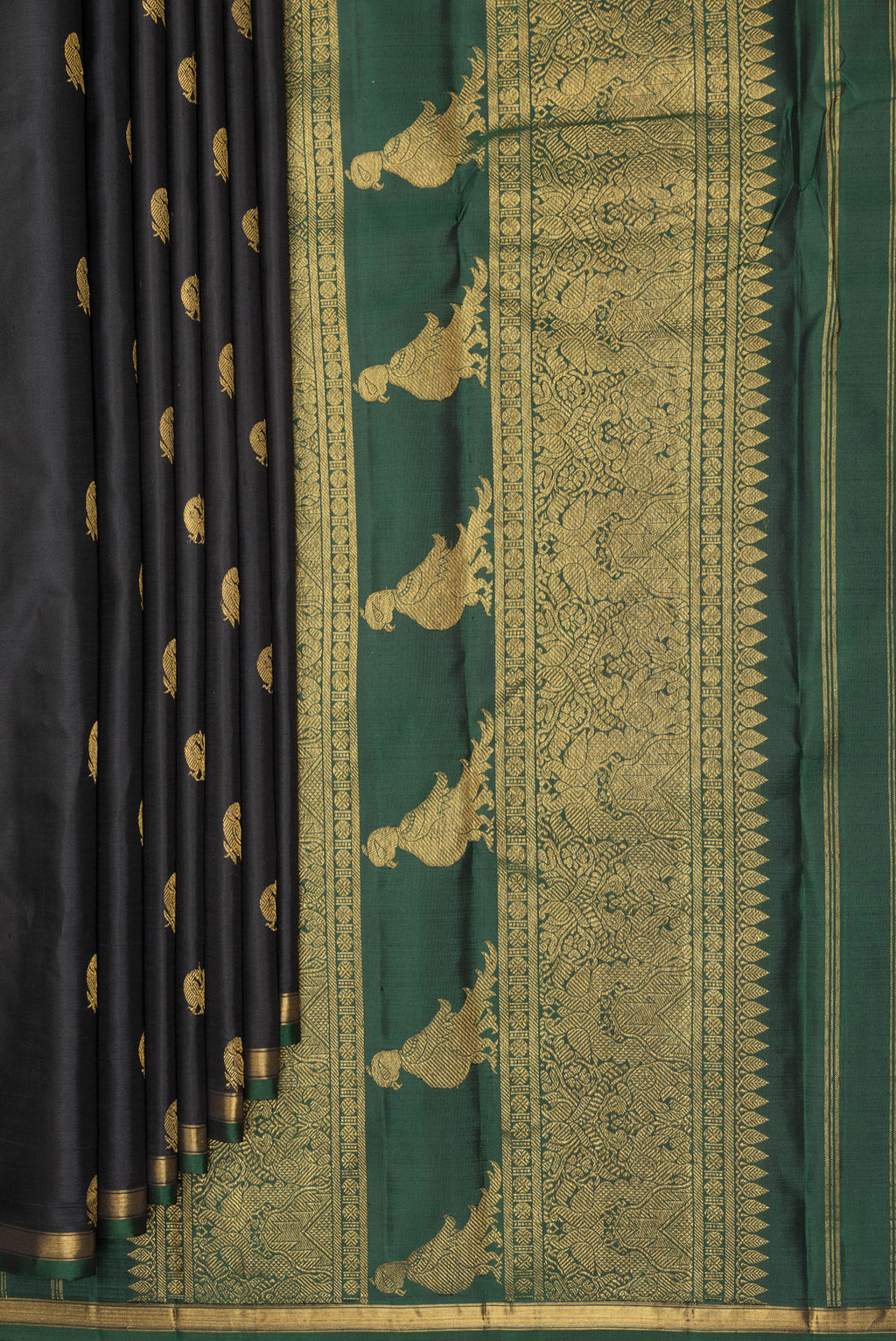 Pleats and pallu of Pure Silk Black Kanchipuram Saree with Zari Butta on the body and Zari Border. 