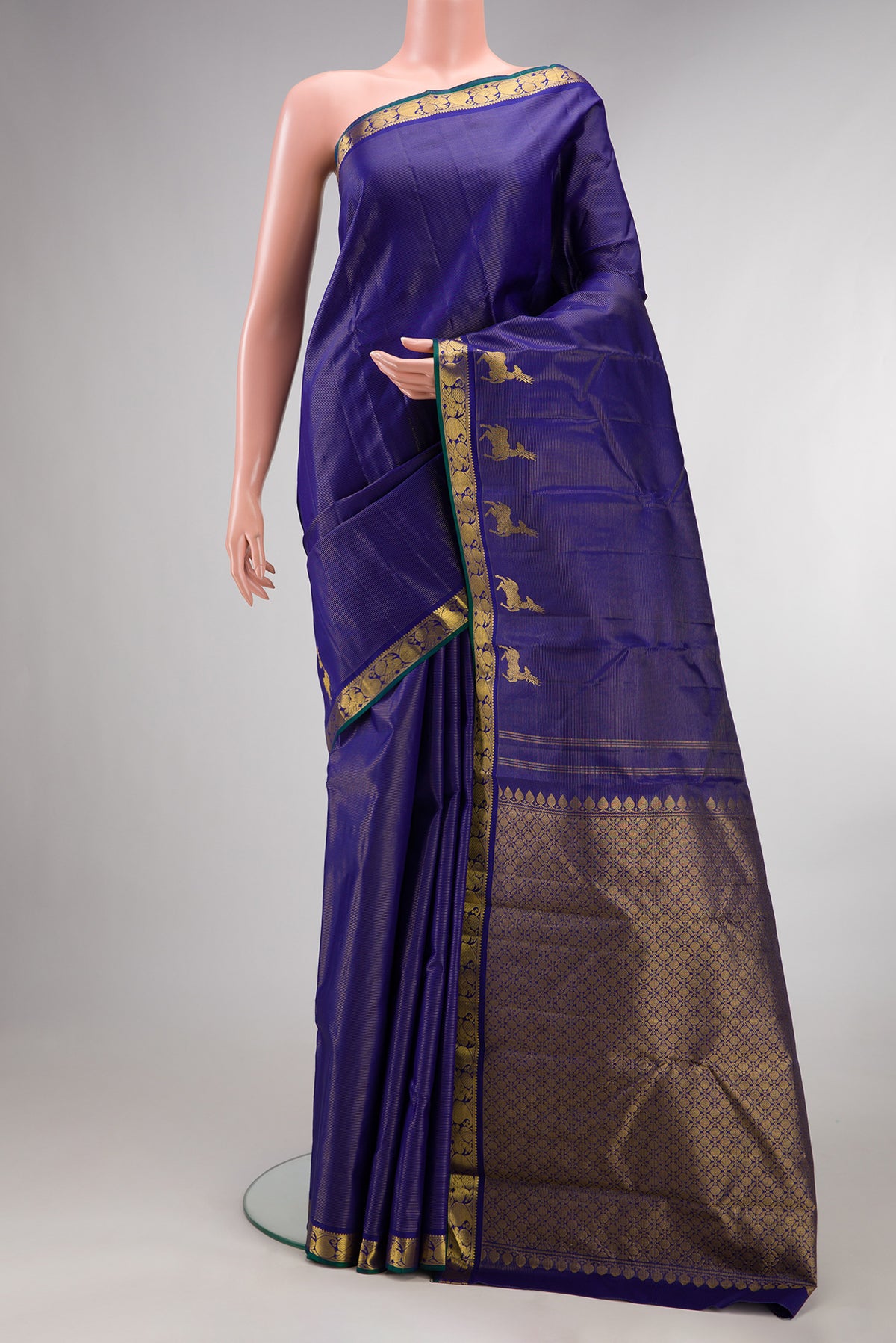 Pure Silk Royal Blue Kanchipuram Saree with Stripes on the body and Fancy Border.  displayed on a mannequin