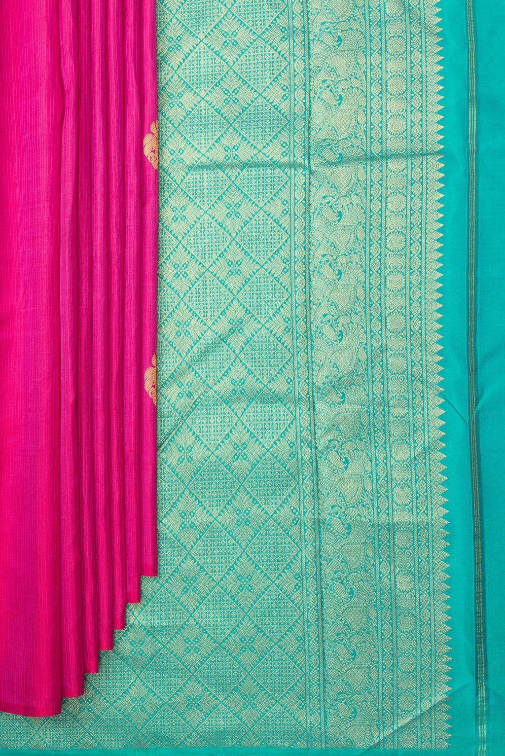 Pleats and pallu of Pure Silk Dark Pink Kanchipuram Saree with Zari Butta on the body and Without Border. 