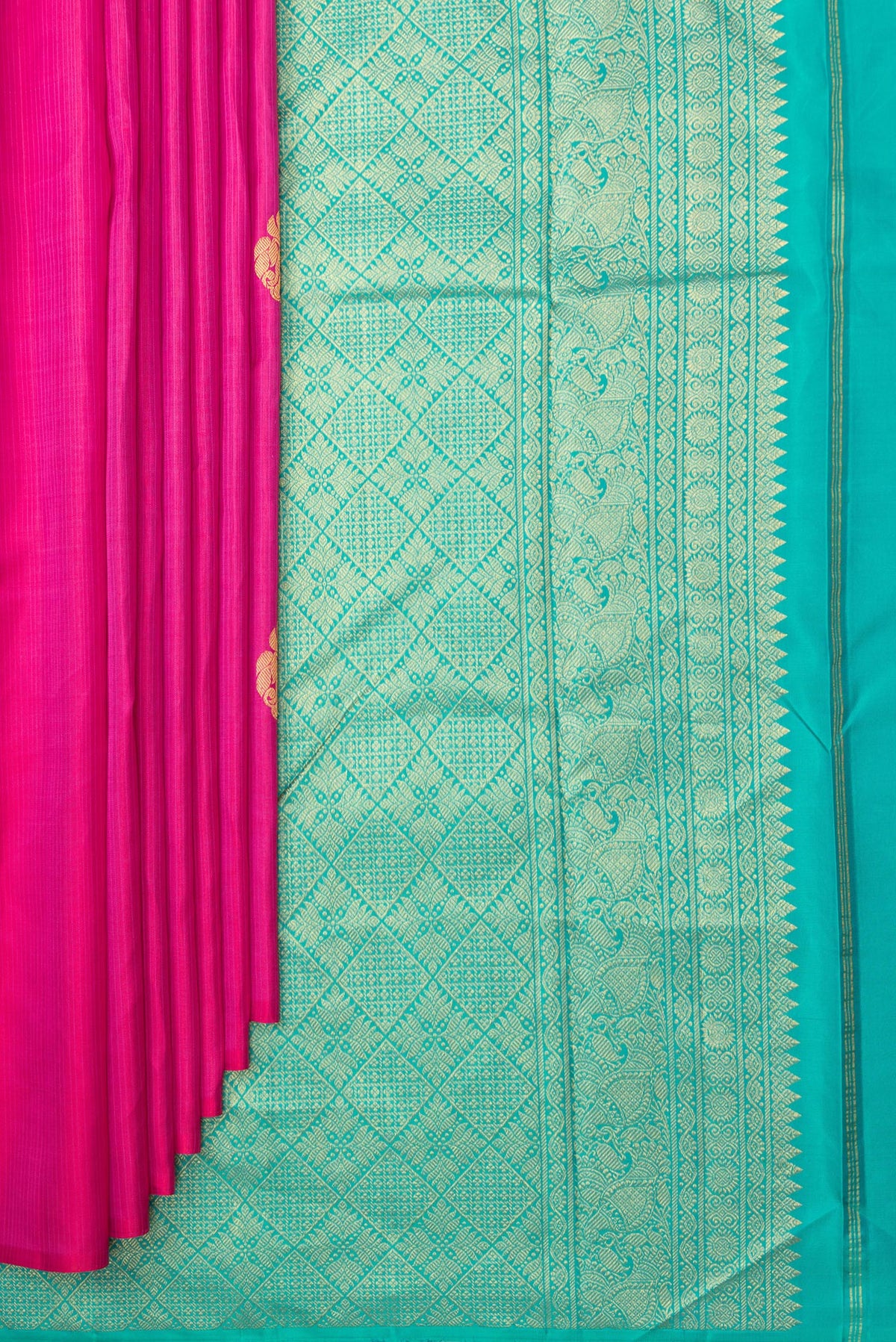 Pleats and pallu of Pure Silk Dark Pink Kanchipuram Saree with Zari Butta on the body and Without Border. 