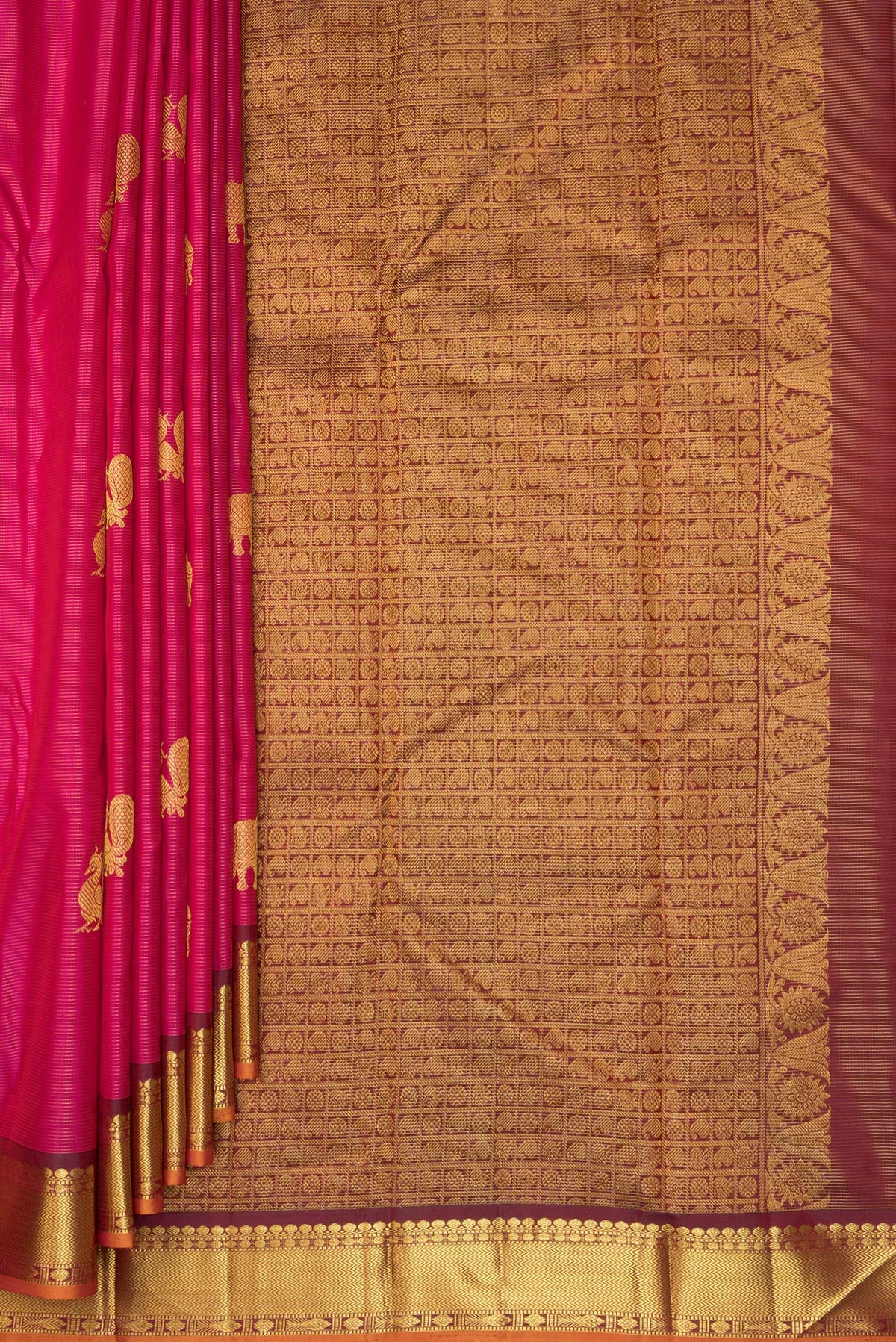 Pleats and pallu of Pure Silk Dark Pink Kanchipuram Saree with Zari Butta on the body and Zari Border. 