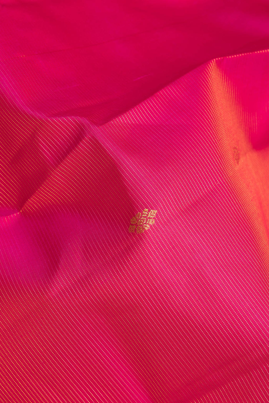 Close up of Pure Silk Pink Dual Tone Kanchipuram Saree with Stripes on the body and Zari Border.  displaying folds