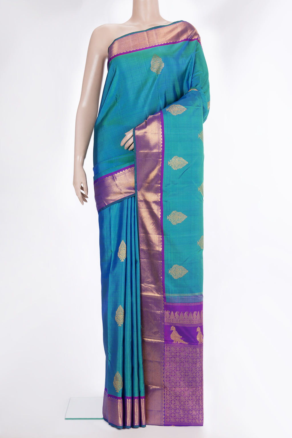 Pure Silk Peacock Blue Kanjivaram Saree with Stripes on the body and Zari Border.  displayed on a mannequin