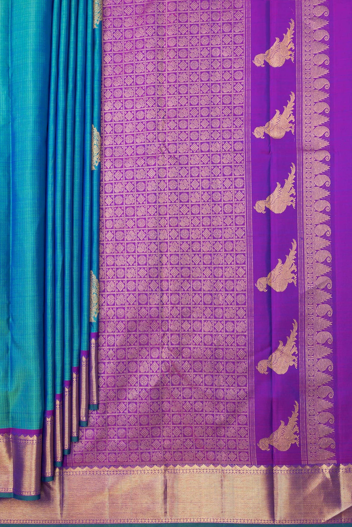 Pleats and pallu of Pure Silk Peacock Blue Kanjivaram Saree with Stripes on the body and Zari Border. 