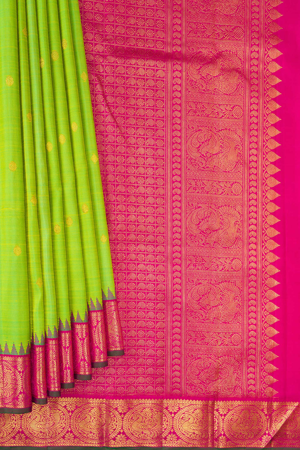 Pleats and pallu of Pure Silk Parrot Green Kanjivaram Saree with Zari Butta on the body and Temple Border. 