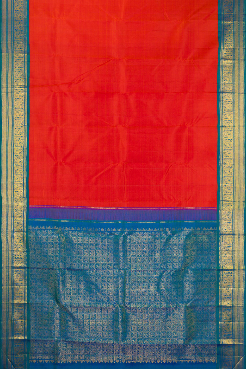 Flat view of Pure Silk Brick Orange Kanjivaram Saree with Plain Body and Zari Border. 