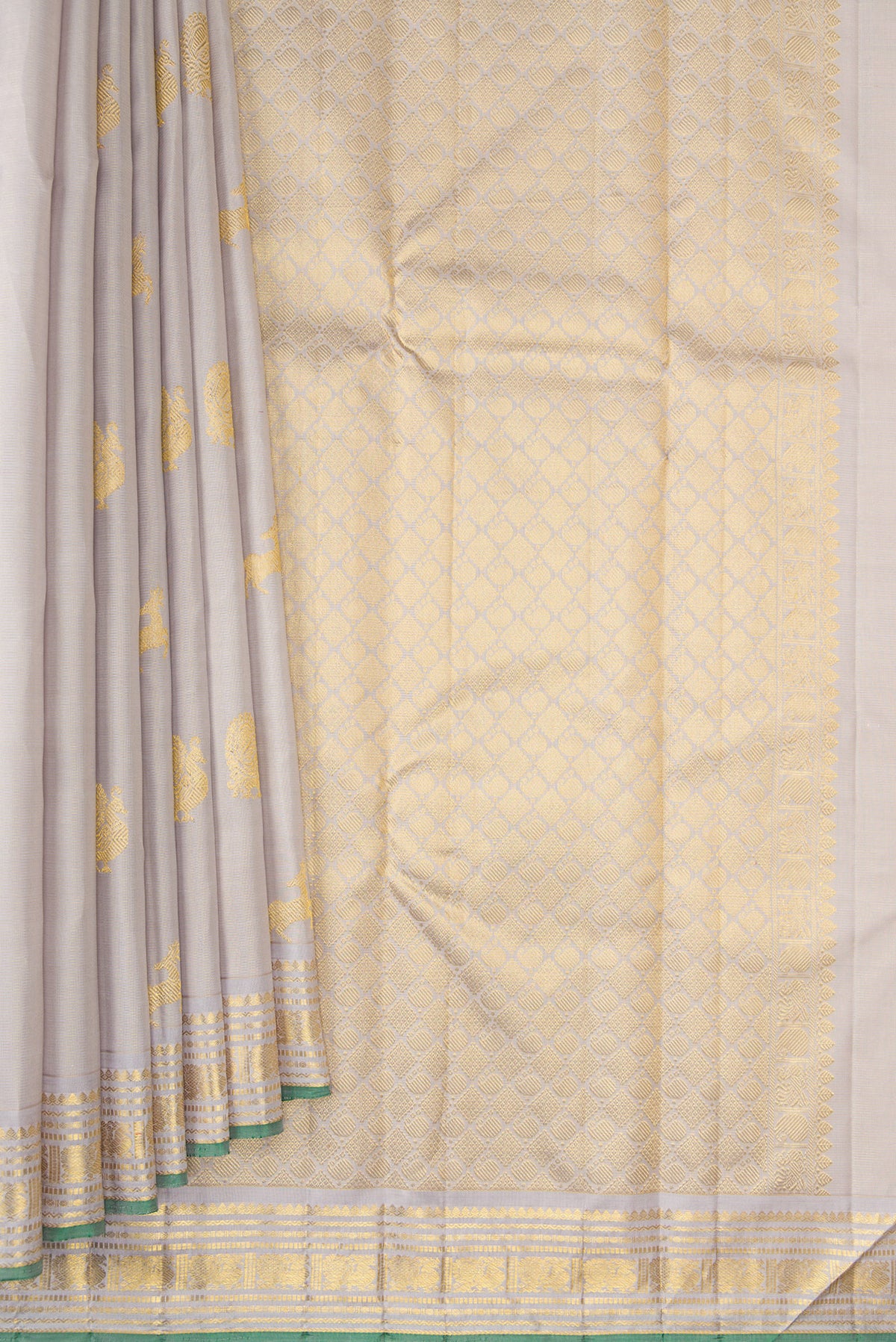Pleats and pallu of Pure Silk Cream Kanjivaram Saree with Zari Butta on the body and Zari Border. 