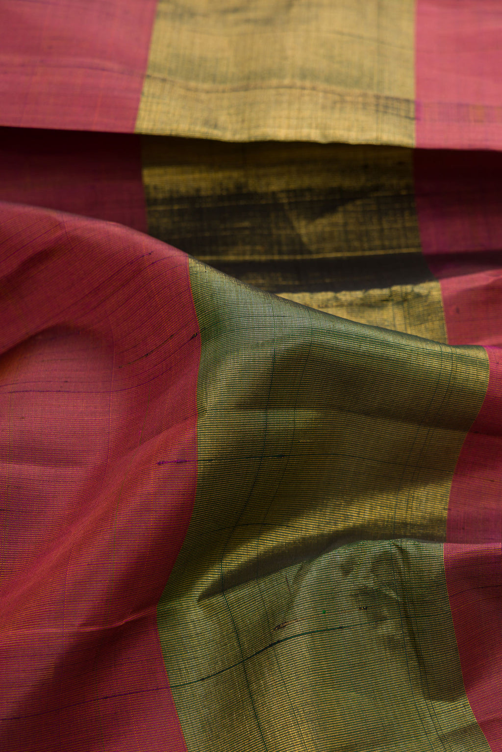Close up of Pure Silk Multi Color Kanjivaram Saree with Checked design on the body and Without Border.  displaying folds