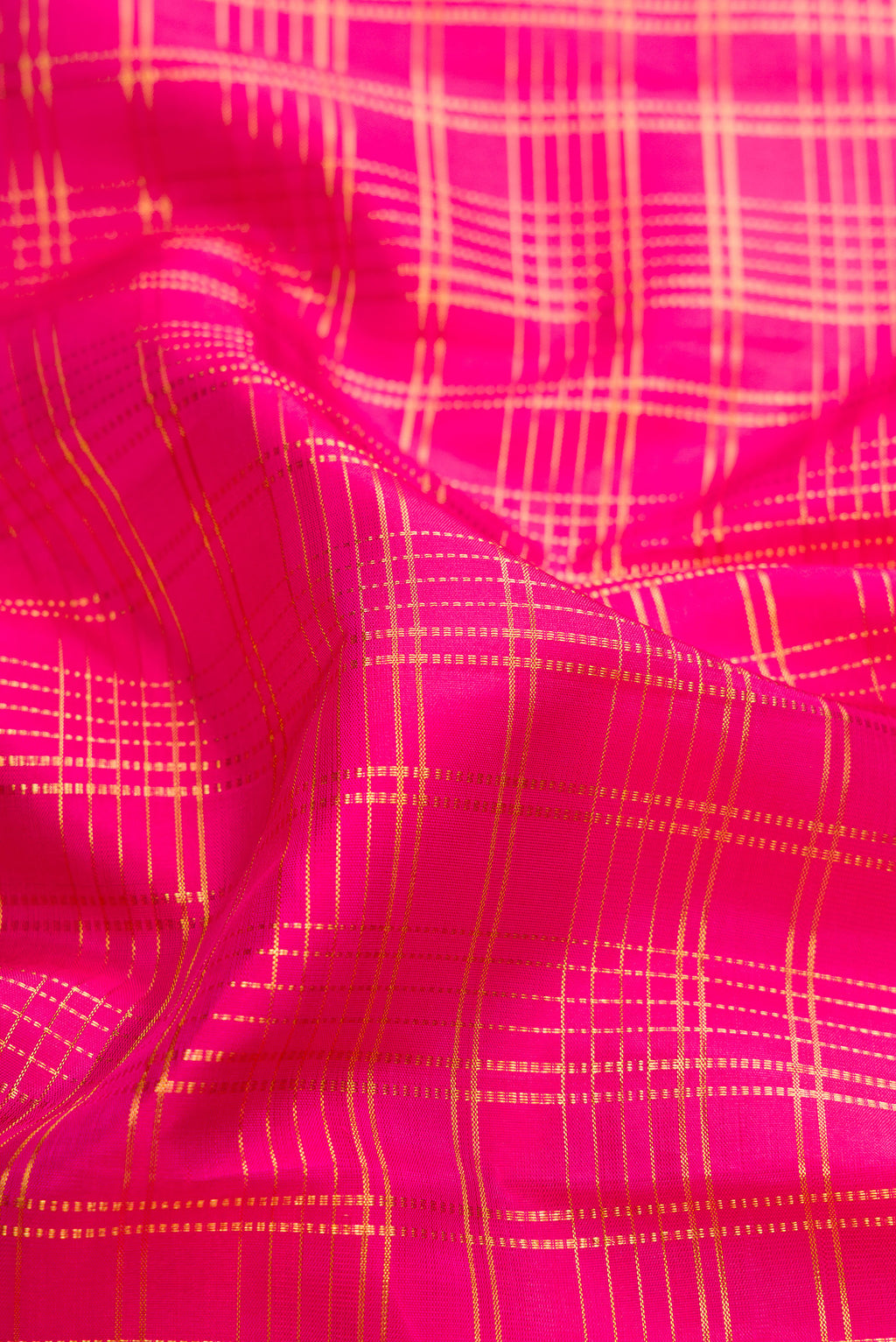 Close up of Pure Silk Pink Kanjivaram Saree with Checked design on the body and Fancy Border.  displaying folds