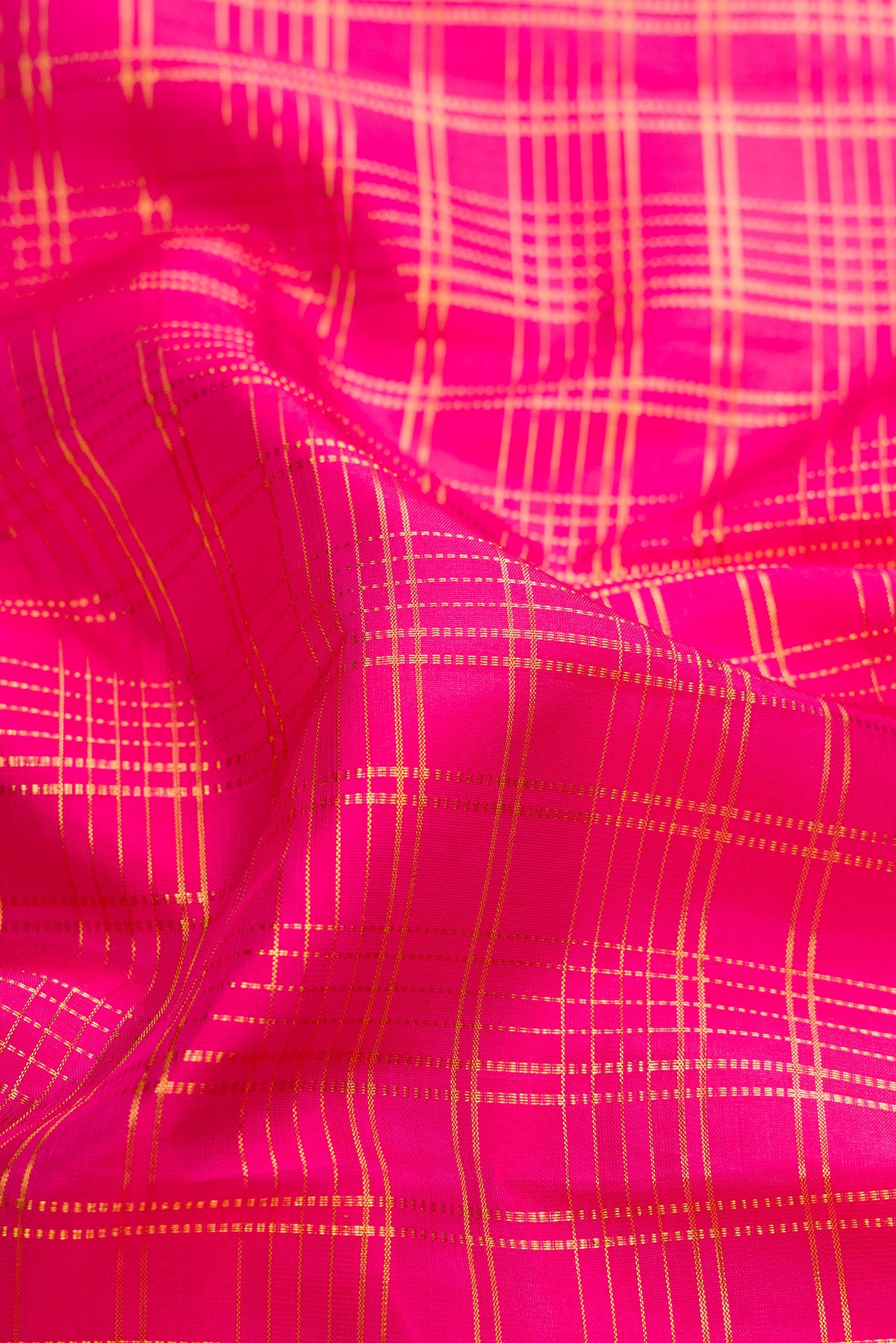 Close up of Pure Silk Pink Kanjivaram Saree with Checked design on the body and Fancy Border.  displaying folds