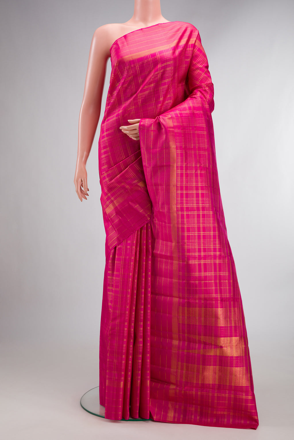 Pure Silk Pink Kanjivaram Saree with Checked design on the body and Fancy Border.  displayed on a mannequin
