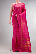 Pure Silk Pink Kanjivaram Saree with Checked design on the body and Fancy Border.  displayed on a mannequin