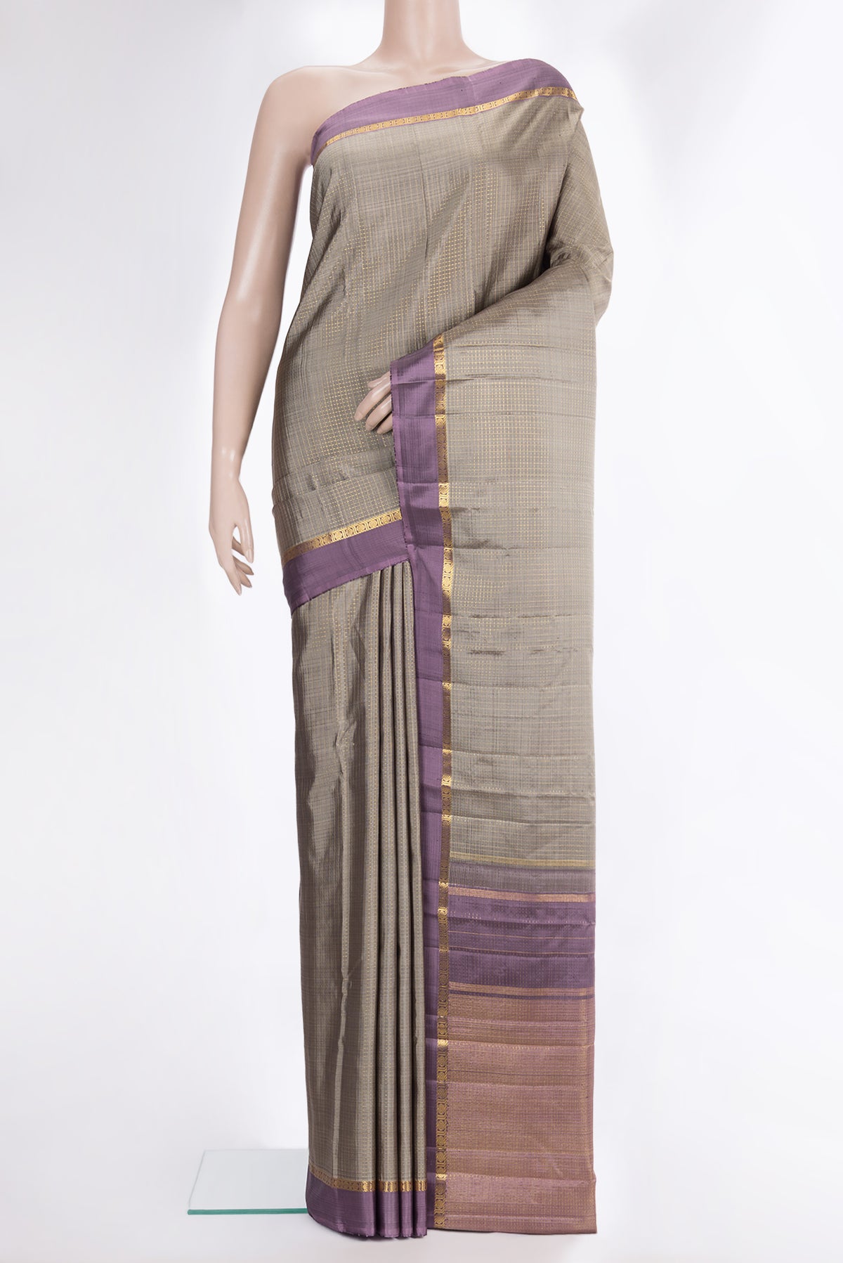 Pure Silk Grey Kanjivaram Saree with Checked design on the body and Zari Border.  displayed on a mannequin