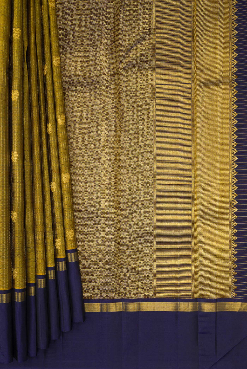 Pleats and pallu of Pure Silk Mehandi Green Kanjivaram Saree with Zari Butta on the body and Plain Border. 