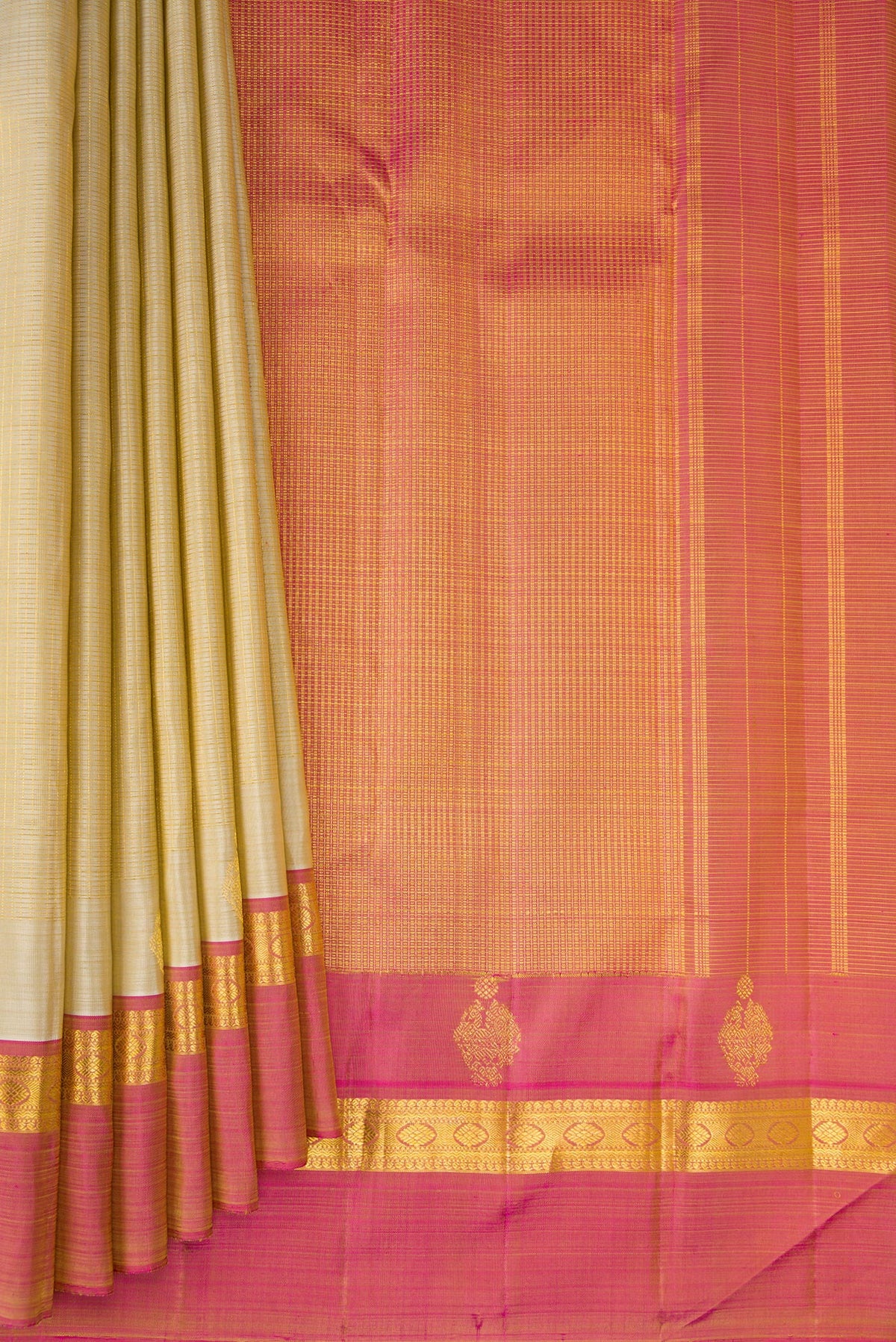 Pleats and pallu of Pure Silk Beige Kanjivaram Saree with Checked design on the body and Zari Border. 
