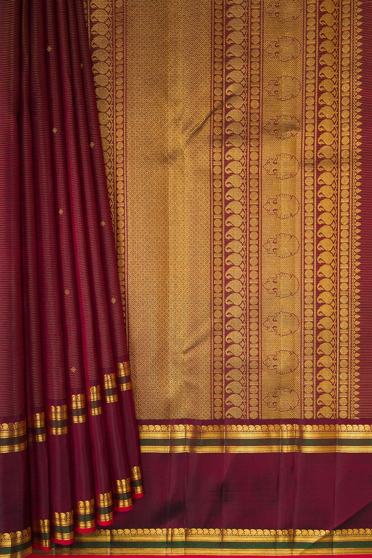 Pleats and pallu of Pure Silk Maroon Kanjivaram Saree with Stripes on the body and Zari Border. 