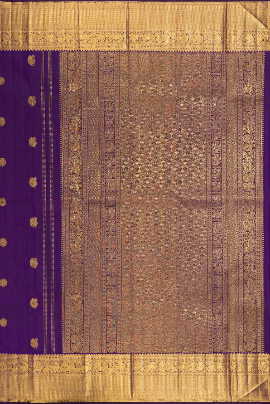Close up image of the pallu of Pure Silk Violet Kanjivaram Saree with Zari Butta on the body and Zari Border. 