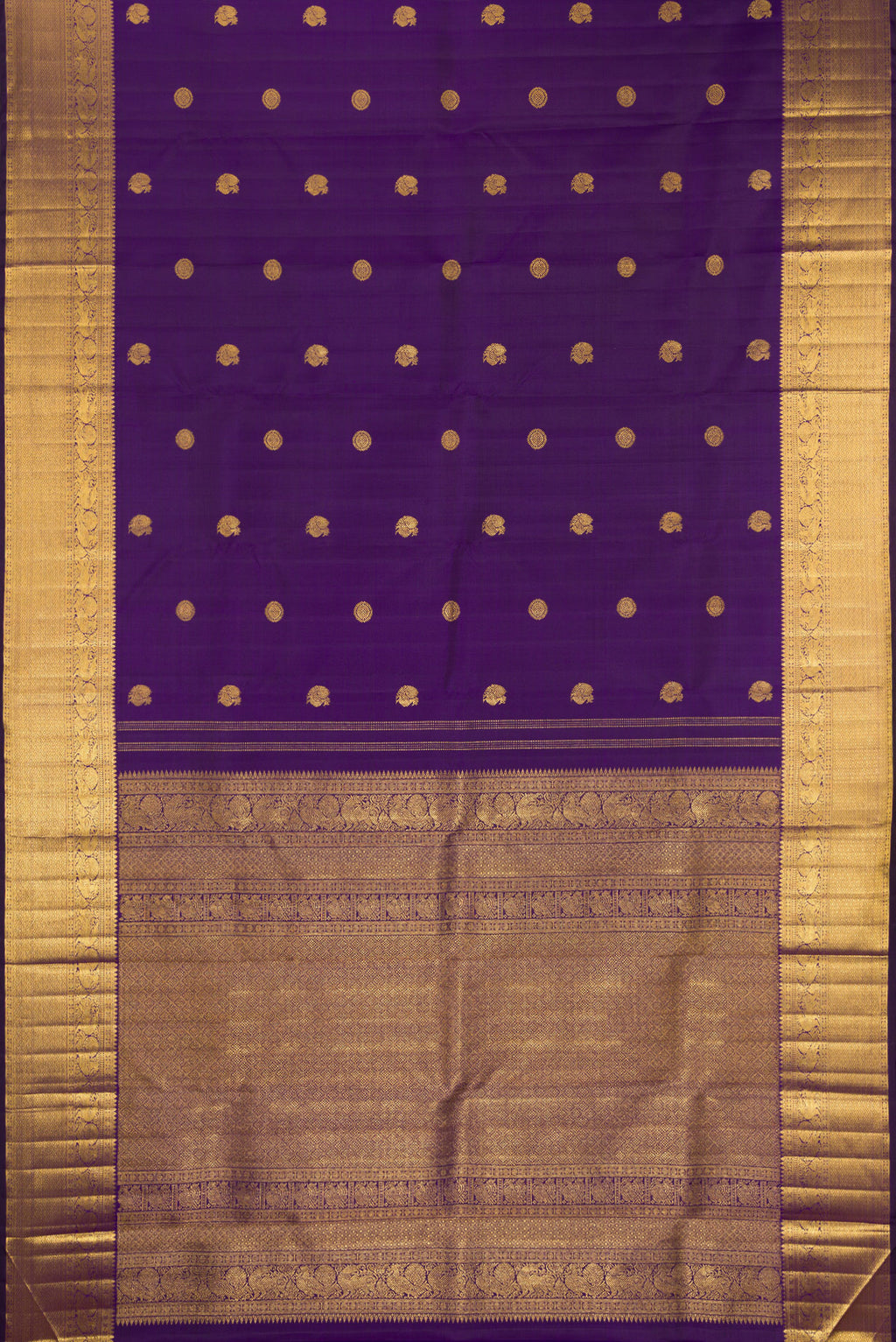 Flat view of Pure Silk Violet Kanjivaram Saree with Zari Butta on the body and Zari Border. 