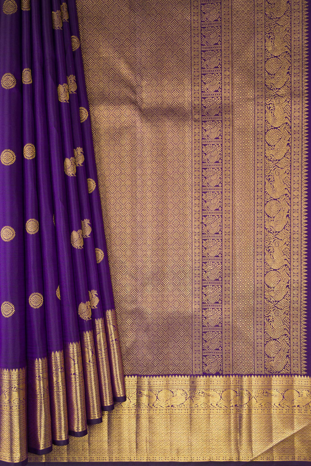 Pleats and pallu of Pure Silk Violet Kanjivaram Saree with Zari Butta on the body and Zari Border. 
