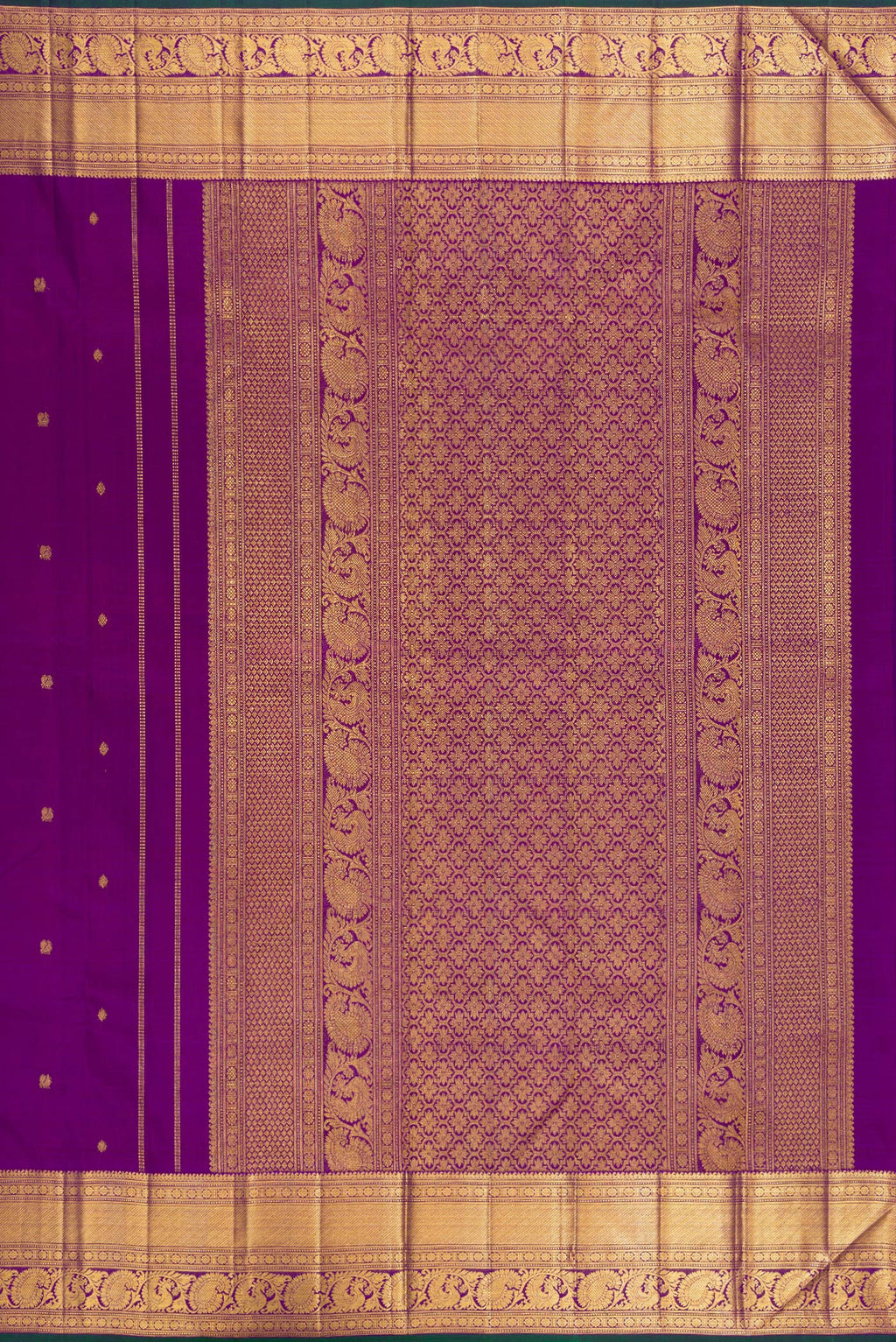 Close up image of the pallu of Pure Silk Purple Kanjivaram Saree with Zari Butta on the body and Zari Border. 