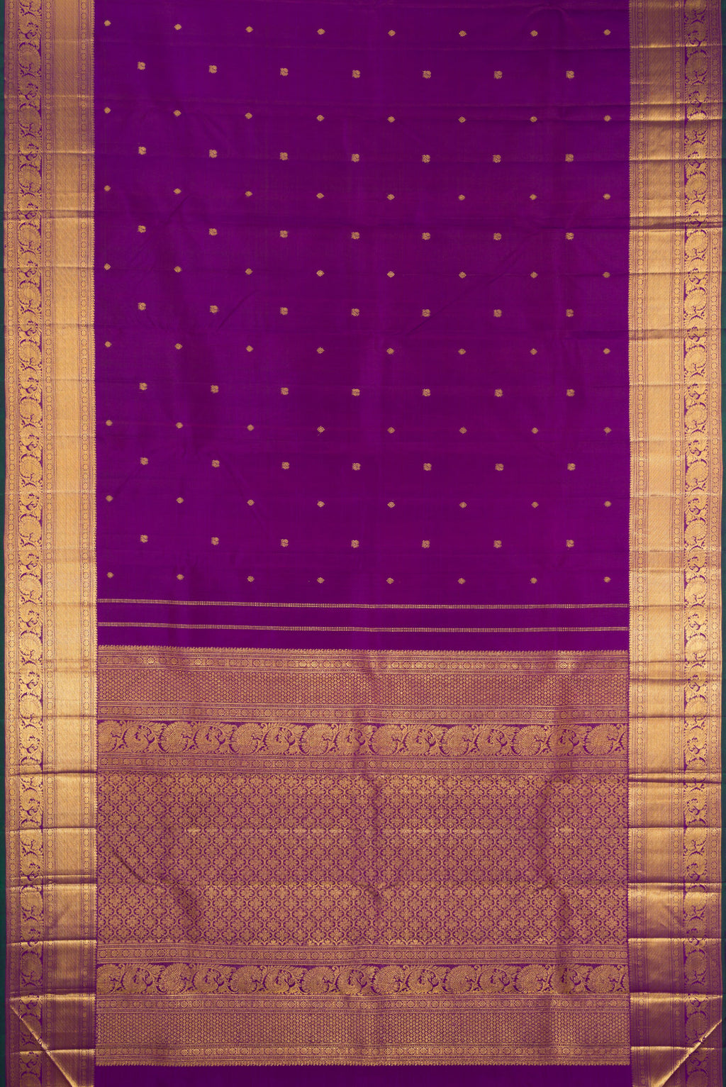 Flat view of Pure Silk Purple Kanjivaram Saree with Zari Butta on the body and Zari Border. 