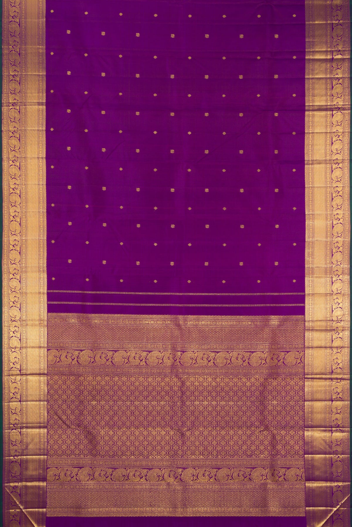 Flat view of Pure Silk Purple Kanjivaram Saree with Zari Butta on the body and Zari Border. 