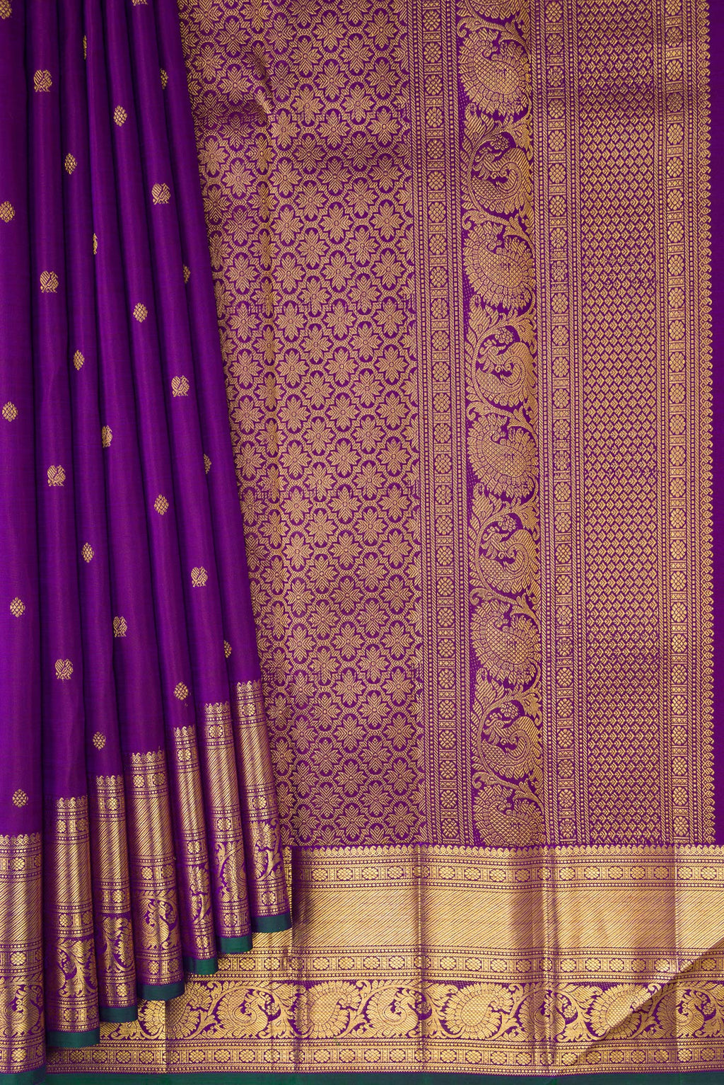 Pleats and pallu of Pure Silk Purple Kanjivaram Saree with Zari Butta on the body and Zari Border. 