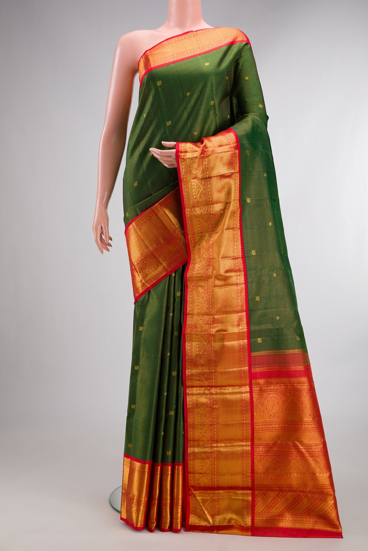 Pure Silk Bottle Green Kanchipuram Saree with Checked design on the body and Zari Border.  displayed on a mannequin