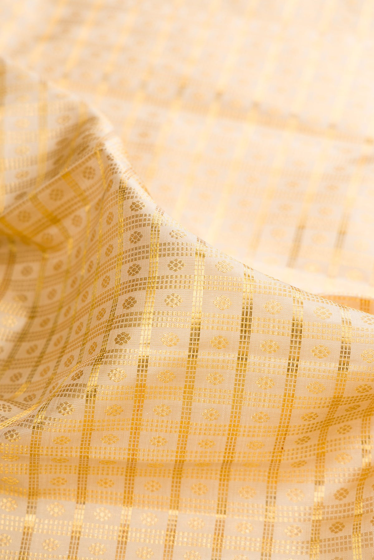 Close up of Pure Silk Sandal Dual Tone Kanchipuram Saree with Zari Brocade on the body and Zari Border.  displaying folds