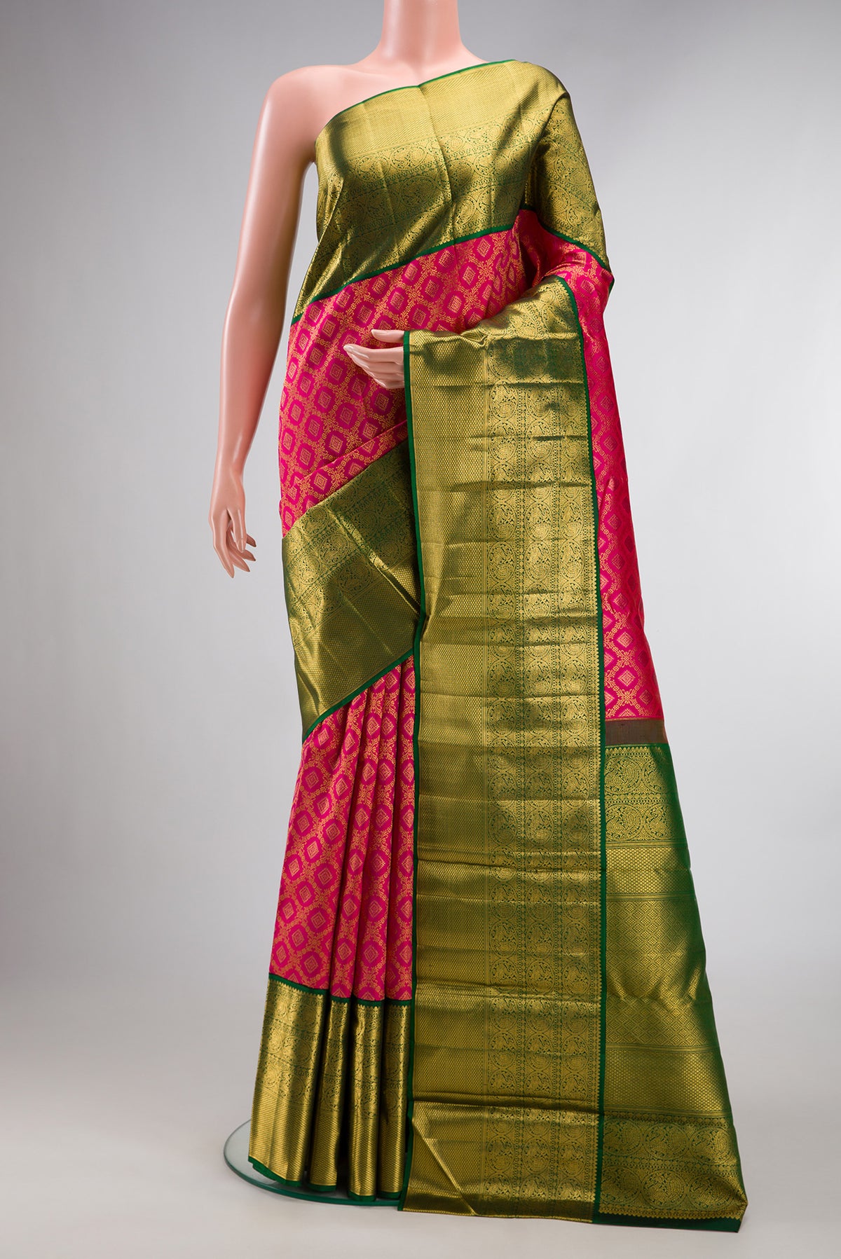Pure Silk Dark Pink Kanchipuram Saree with Zari Brocade on the body and Zari Border.  displayed on a mannequin