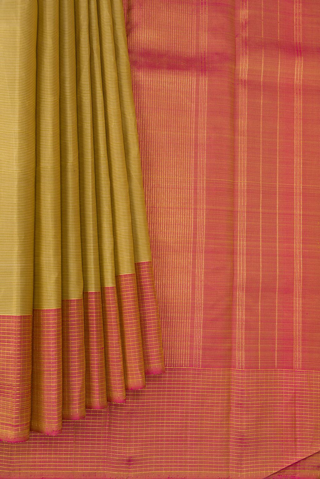 Pleats and pallu of Pure Silk Gold Kanjivaram Saree with Stripes on the body and Checks Border. 