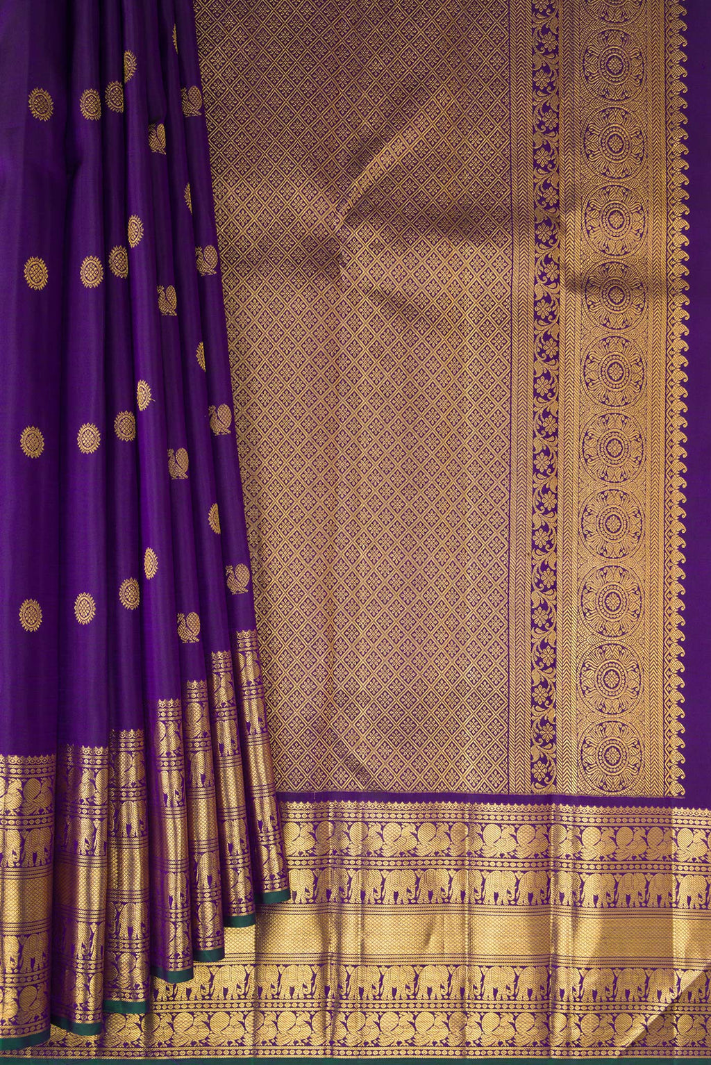 Pleats and pallu of Pure Silk Violet Kanchipuram Saree with Zari Butta on the body and Zari Border. 