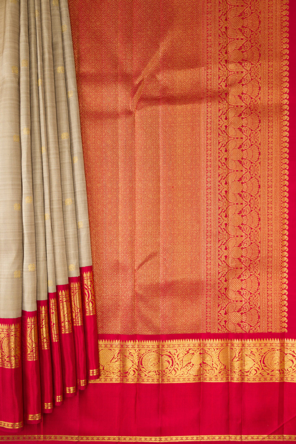Pleats and pallu of Pure Silk Dark Beige Kanchipuram Saree with Zari Butta on the body and Zari And Thread Border. 