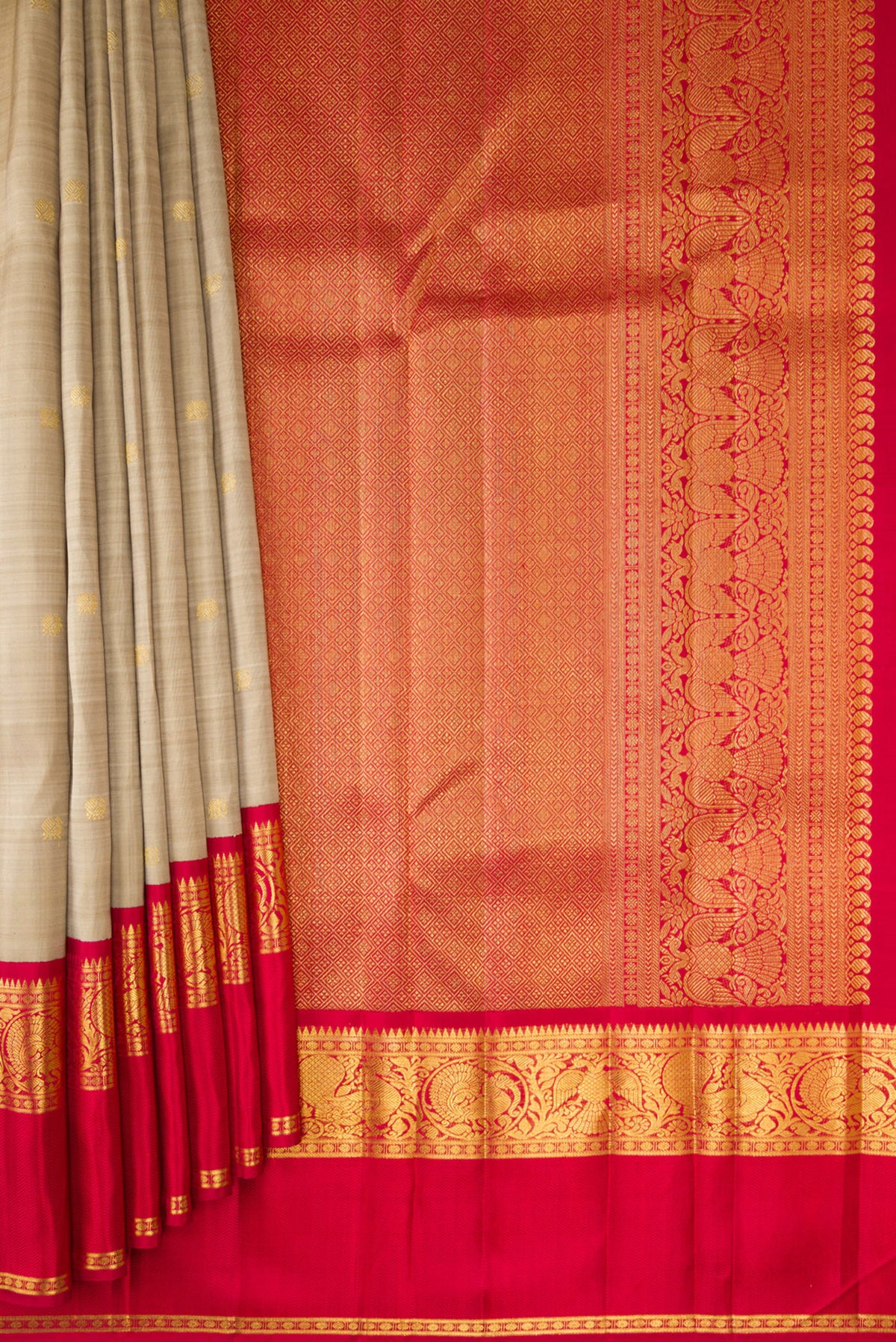 Pleats and pallu of Pure Silk Dark Beige Kanchipuram Saree with Zari Butta on the body and Zari And Thread Border. 