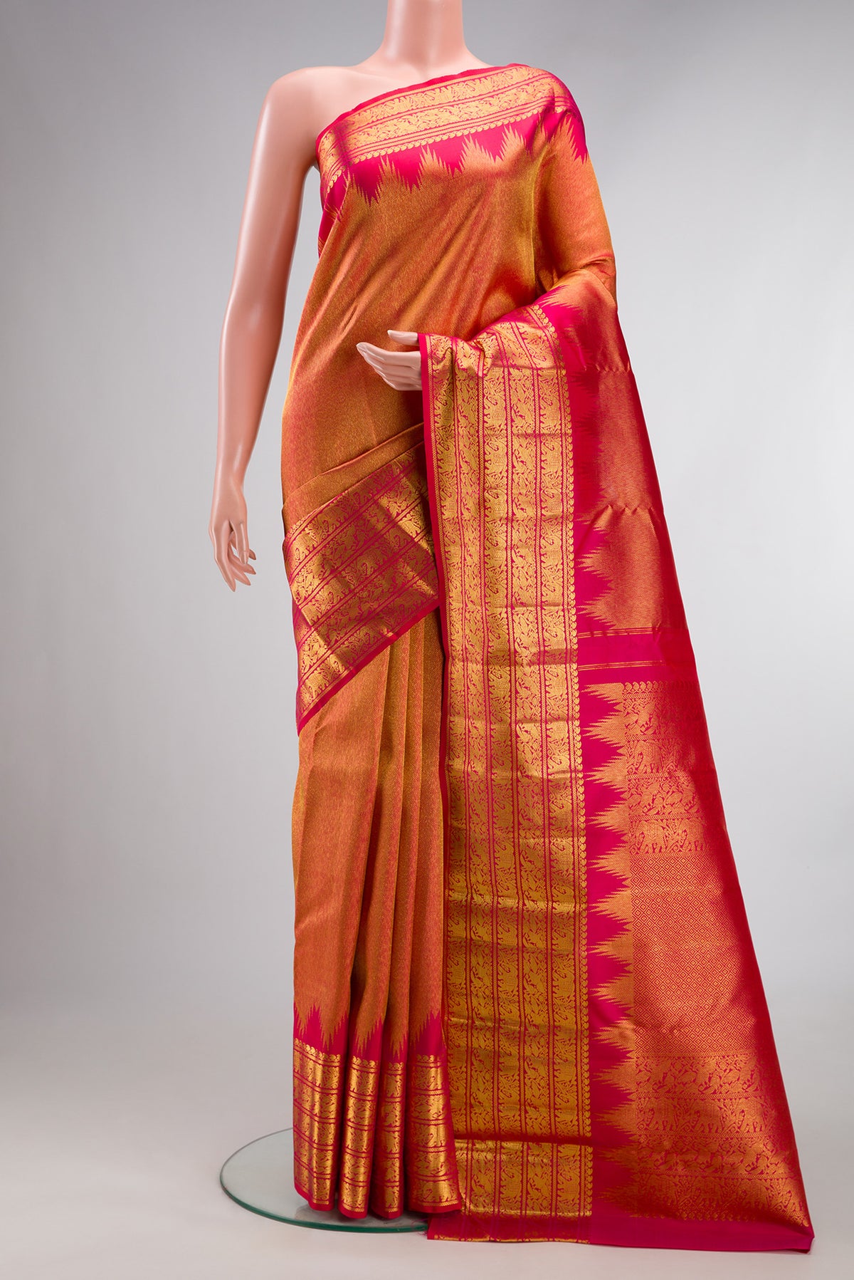 Pure Silk Dark Pink Kanchipuram Saree with Zari Brocade on the body and Zari Border.  displayed on a mannequin
