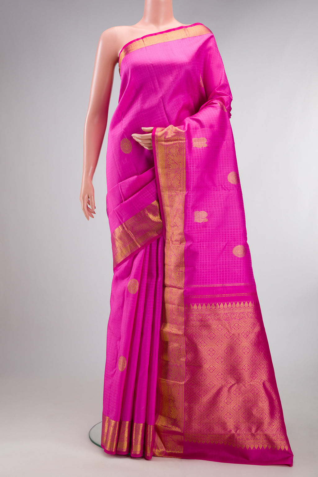 Pure Silk Pink Kanchipuram Saree with Jacquard With Zari Butta on the body and Zari Border.  displayed on a mannequin