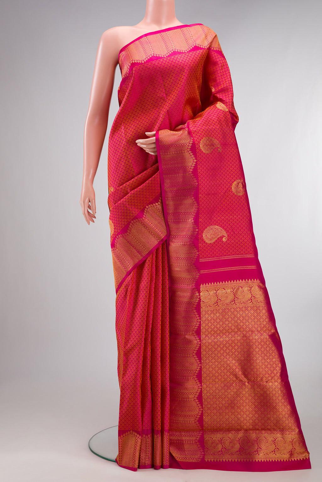 Pure Silk Dark Pink Dual Tone Kanchipuram Saree with Jacquard With Zari Butta on the body and Fancy Border.  displayed on a mannequin
