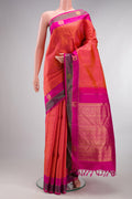 Pure Silk Orange Dual Tone Kanjivaram Saree with Jacquard design on the body and Fancy Border.  displayed on a mannequin
