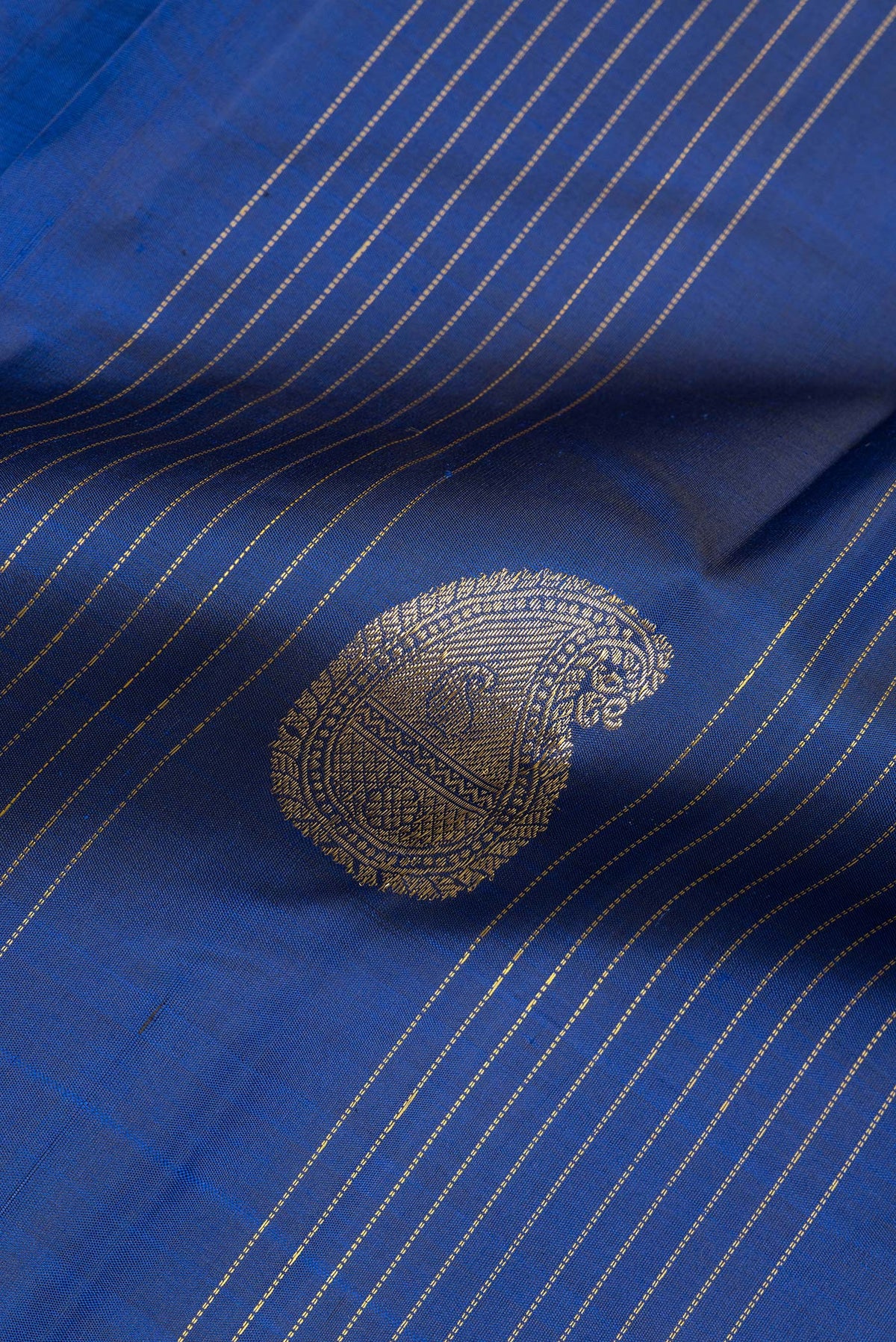 Close up of Pure Silk Navy Blue Kanjivaram Saree with Stripes on the body and Without Border.  displaying folds