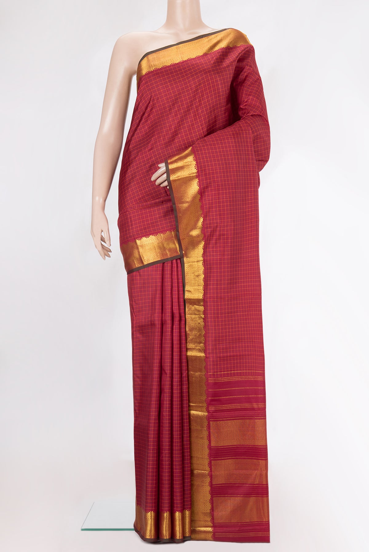 Pure Silk Deep Red Kanchipuram Saree with Checked design on the body and Zari Border.  displayed on a mannequin