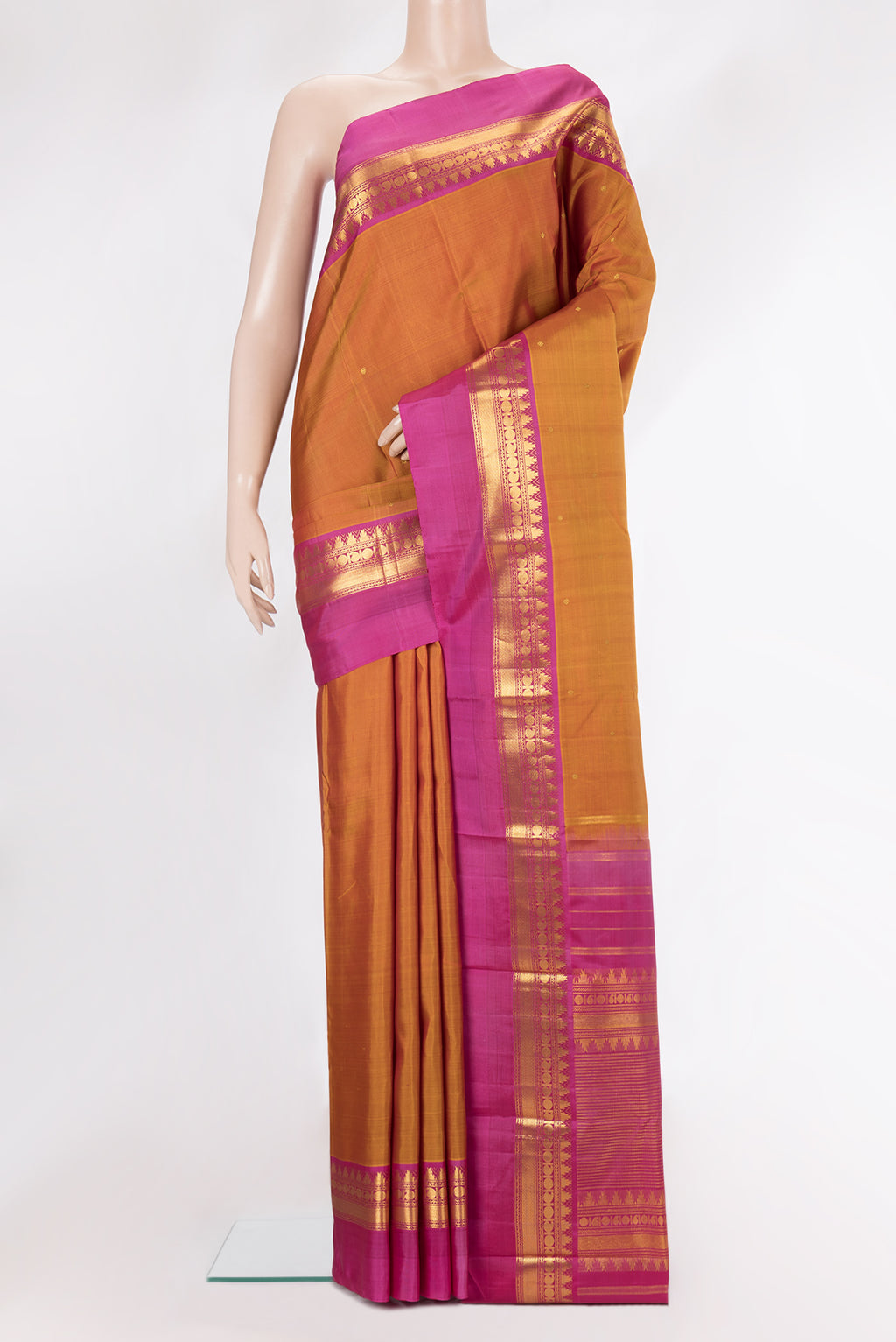 Pure Silk Mustard Dual Tone Kanjivaram Saree with Zari Butta on the body and Zari Border.  displayed on a mannequin