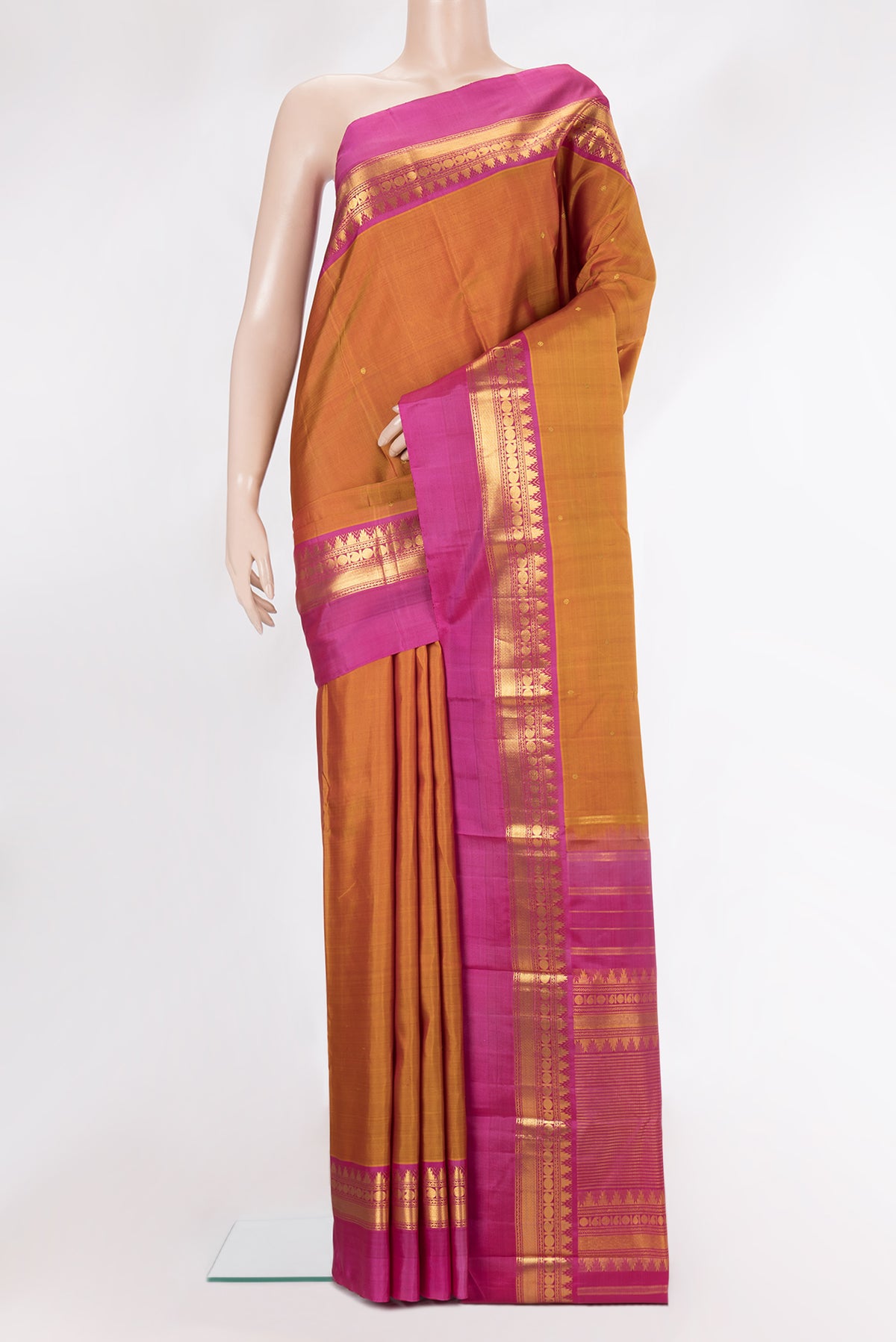 Pure Silk Mustard Dual Tone Kanjivaram Saree with Zari Butta on the body and Zari Border.  displayed on a mannequin