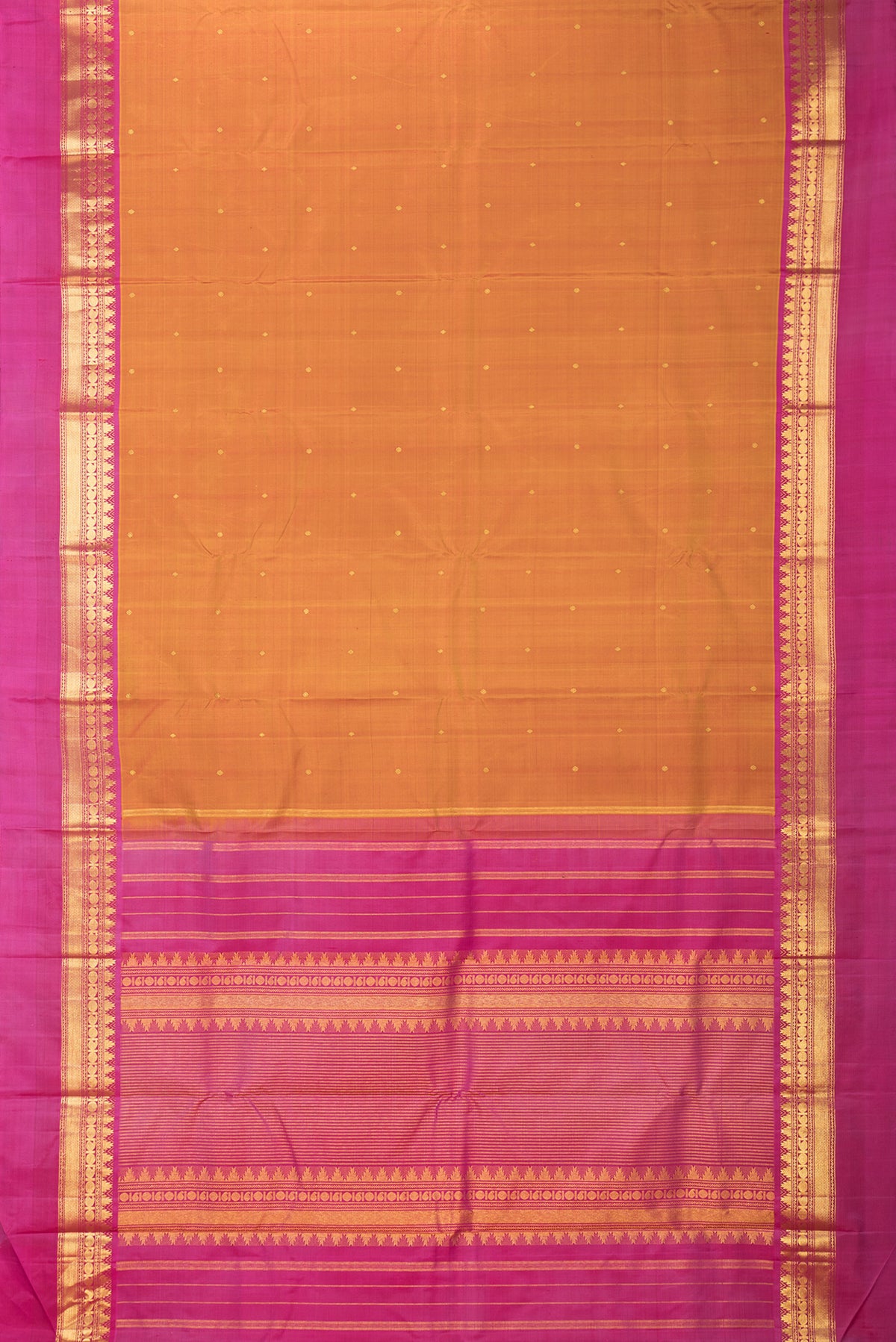 Flat view of Pure Silk Mustard Dual Tone Kanjivaram Saree with Zari Butta on the body and Zari Border. 
