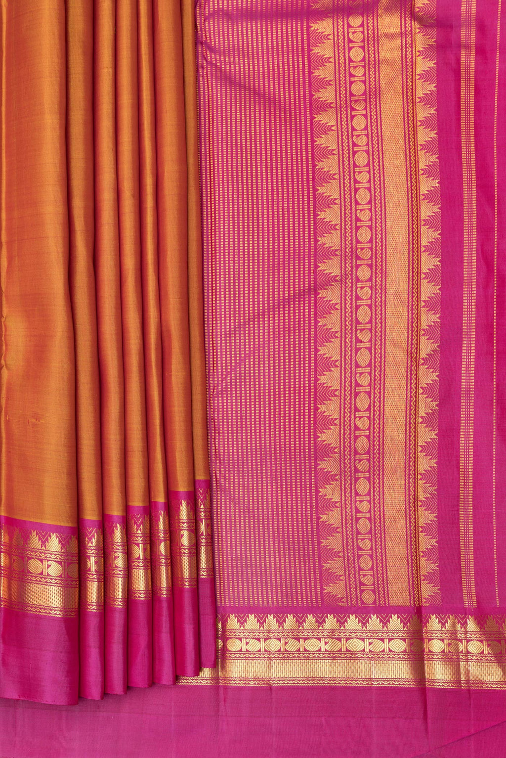 Pleats and pallu of Pure Silk Mustard Dual Tone Kanjivaram Saree with Zari Butta on the body and Zari Border. 