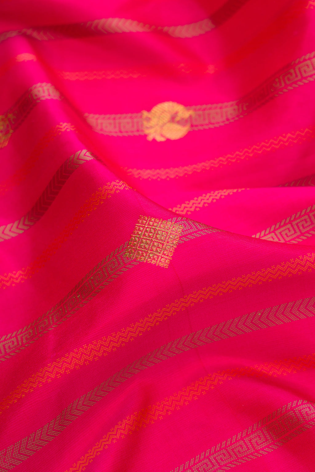 Close up of Pure Silk Dark Pink Dual Tone Kanjivaram Saree with Stripes on the body and Without Border.  displaying folds