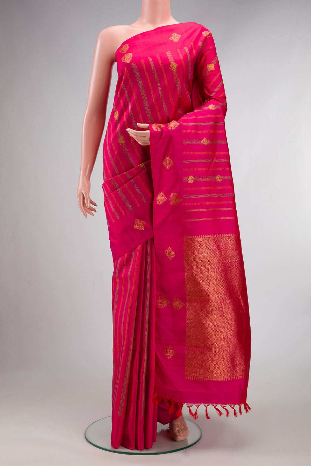 Pure Silk Dark Pink Dual Tone Kanjivaram Saree with Stripes on the body and Without Border.  displayed on a mannequin