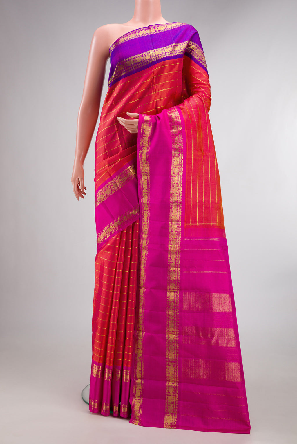 Pure Silk Coral Dual Tone Kanjivaram Saree with Veldhari on the body and Ganga Jamuna Border.  displayed on a mannequin