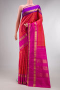 Pure Silk Coral Dual Tone Kanjivaram Saree with Veldhari on the body and Ganga Jamuna Border.  displayed on a mannequin